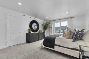 Bedroom with carpet floors and recessed lighting