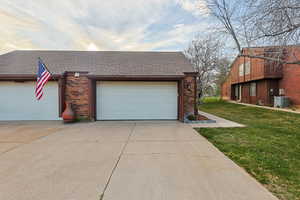 Garage with concrete driveway