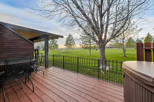 Wooden deck featuring a lawn