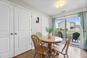 Dining space featuring tile patterned floors