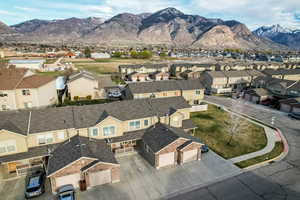 Aerial view of residential area featuring a mountainous background