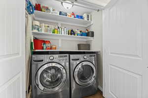 Laundry area featuring washing machine and clothes dryer