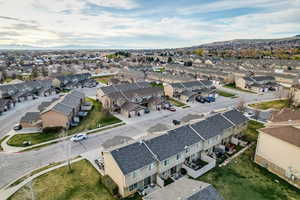 Aerial perspective of suburban area featuring a mountain backdrop