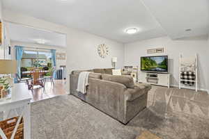 Living area featuring carpet flooring