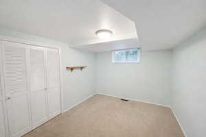 Unfurnished bedroom featuring a closet and carpet