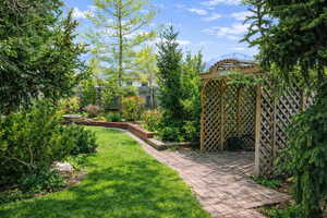 Fenced yard with a mountain view and a patio