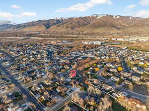 Aerial perspective of suburban area featuring a mountain backdrop