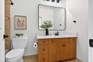 Bathroom with vanity and toilet
