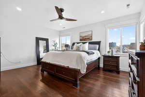 Bedroom featuring dark wood-style flooring and ceiling fan