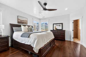 Bedroom featuring dark wood finished floors, ceiling fan, recessed lighting, and connected bathroom
