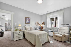 Carpeted bedroom with baseboards