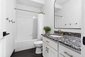 Bathroom featuring vanity and shower / bath combo