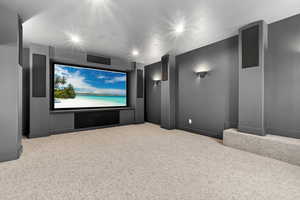 Cinema featuring light colored carpet and recessed lighting