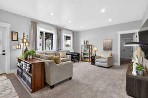 Living area with baseboards and recessed lighting