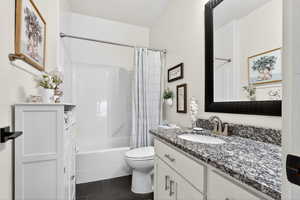 Full bathroom with vanity and shower / tub combo with curtain