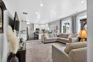 Living room featuring recessed lighting and carpet flooring
