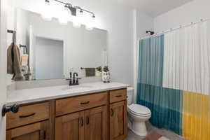 Full bath with vanity and shower / tub combo with curtain
