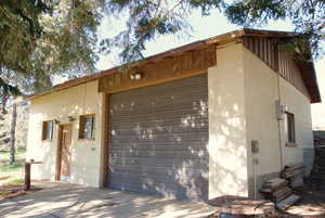 Exterior space with an outdoor structure and concrete block siding