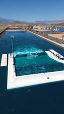 View of swimming pool featuring a water and mountain view