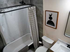 Main bathroom with vanity and shower / bath combination with curtain