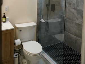 Primary ensuite bathroom with vanity, walk in shower
