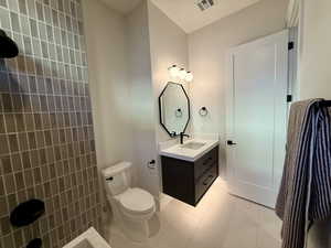 Bathroom with vanity and light tile patterned flooring