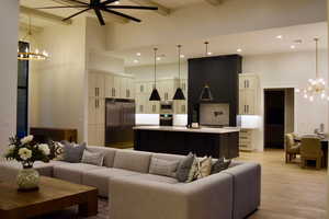 Living room featuring a chandelier and light wood-type flooring