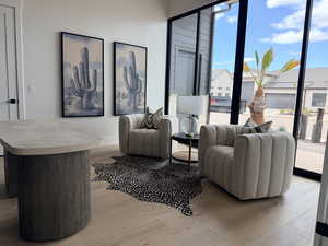 Living area with light wood finished floors