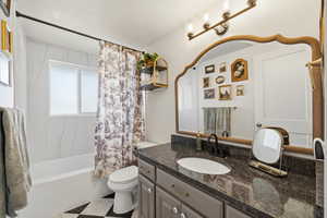 Full bath with vanity, shower / bath combination with curtain, and light flooring