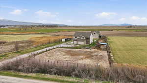 Overview of rural landscape featuring a mountain backdrop