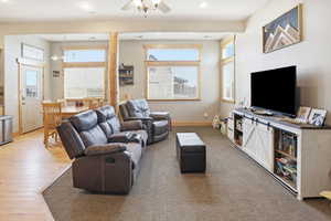 Living room featuring recessed lighting and a ceiling fan