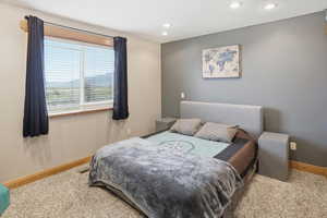 Bedroom featuring recessed lighting and light colored carpet