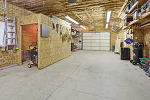 Garage featuring freestanding refrigerator