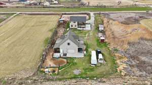 Overview of the main house, property, horse arena, Detached workshop/garage, horse stalls, chicken coop, garden, and ADU.