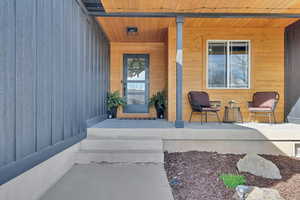 Property entrance featuring covered porch