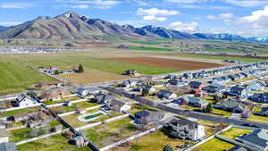 Aerial perspective of suburban area featuring a mountain backdrop