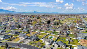 Aerial perspective of suburban area featuring a mountainous background