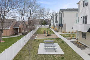 View of yard with picnic tables, TOT-LOT, and green space.