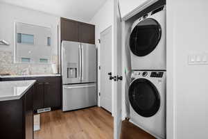 Laundry smartly tucked away off of the kitchen for efficiency and utility.