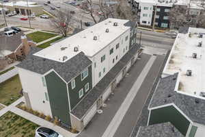 Bird's eye view of garage side of townhomes.