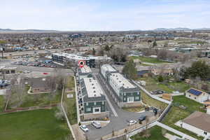 Aerial view of property's location with mountain and city views.