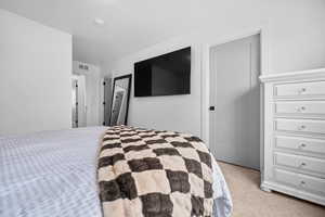 Owner's Suite with walk-in closet and attached 3/4 bathroom.