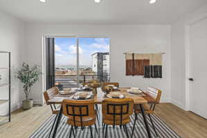 Dining area featuring light wood-style floors and recessed lighting