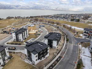 Aerial perspective of suburban area featuring a large body of water