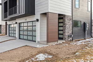 View of exterior entry featuring stone siding