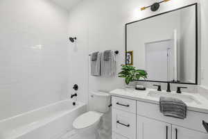 Full bath featuring vanity and tub / shower combination
