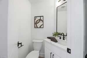 Bathroom featuring vanity and toilet