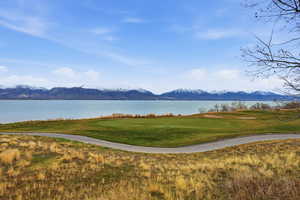 View of home's community featuring a water and mountain view