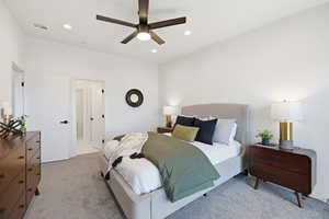 Bedroom featuring light carpet, ceiling fan, and recessed lighting