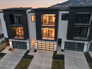 Modern home with an attached garage and concrete driveway